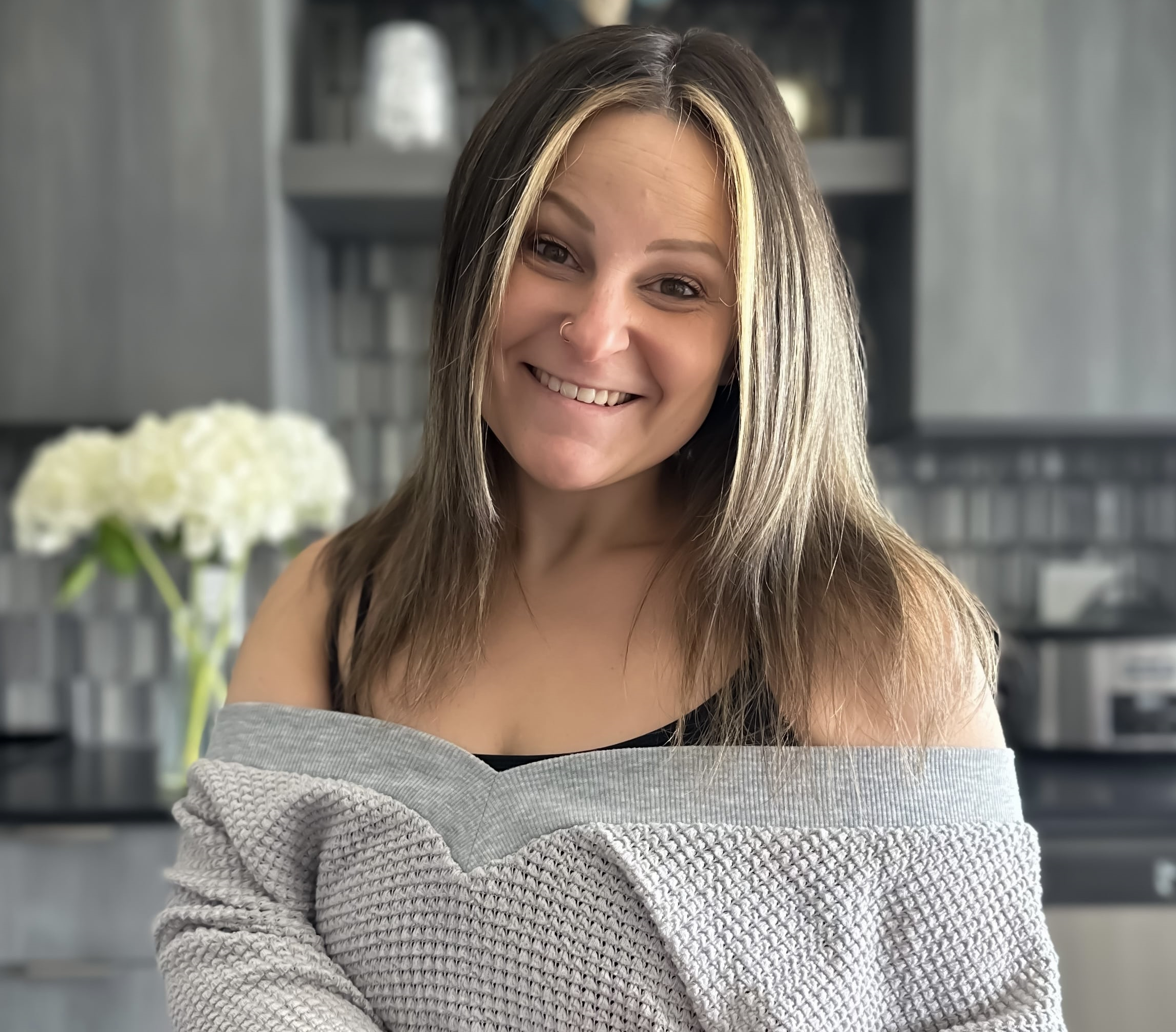 Headshot of Tracy Block of Block Media Worldwide standing in the kitchen